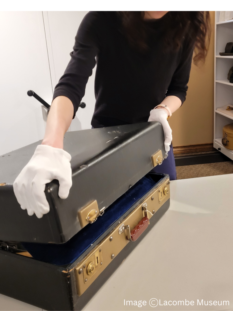 Accordion case being opened by assistant archivist